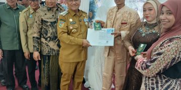 Pemerintah Kota (Pemkot) Jambi bersama Badan Amil Zakat Nasional (BAZNAS) Kota Jambi dan Asosiasi Penghulu Republik Indonesia (APRI) menyelenggarakan Program Nikah dan Walimah Massal Tahun 2026